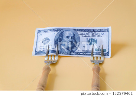 A dollar note on end of fork Business concept. A dollar note on end of fork Business concept. 132579461