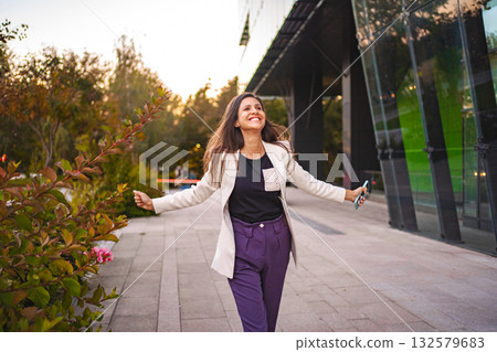 Smiling businesswoman feeling excited after finnshing work 132579683