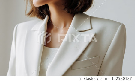 Elegant woman in a light suit 132580187