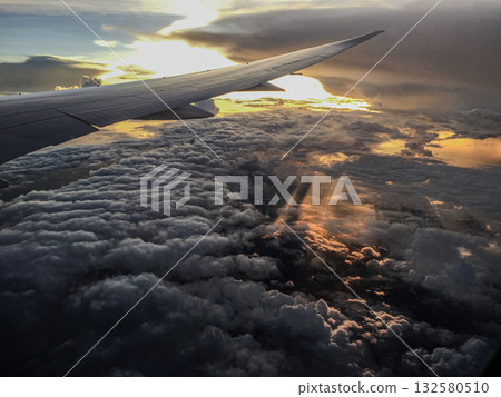 A sunset glow seen from an airplane A sunset glow seen from an airplane 132580510