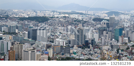 Seoul cityscape panorama showing urban buildings and mountains Seoul cityscape panorama showing urban buildings and mountains 132581239