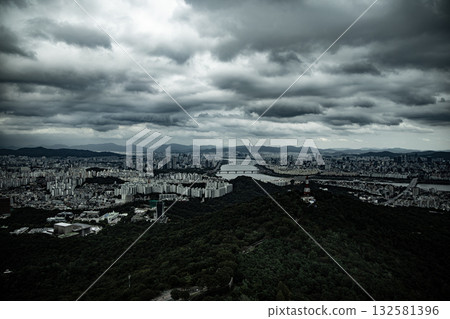 Seoul cityscape panorama under dramatic cloudy sky Seoul cityscape panorama under dramatic cloudy sky 132581396