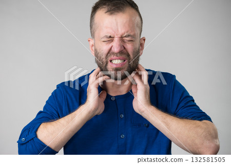 Man having throat, neck pain Man having throat, neck pain 132581505