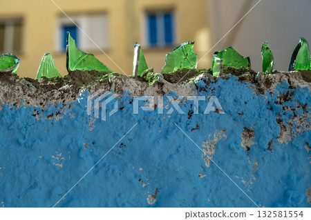 close-up fence with broken glass 132581554
