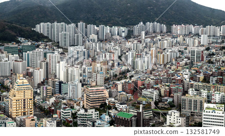Busan cityscape showing urban residential buildings and mountains Busan cityscape showing urban residential buildings and mountains 132581749