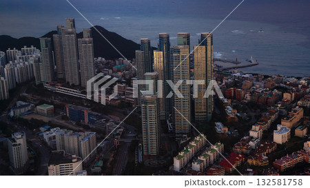 Busan city skyline reflecting golden hour light at twilight 132581758