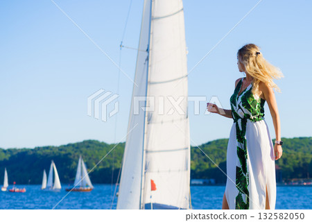 Woman in summer long dress against sea 132582050