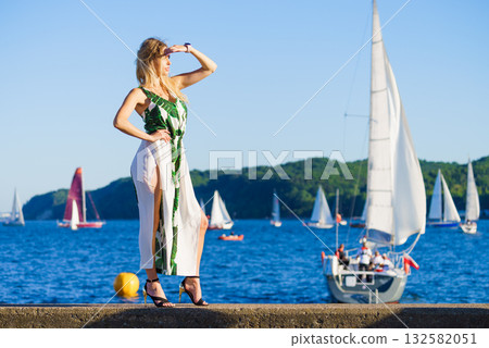 Woman in summer long dress against sea 132582051