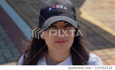 Woman tourist wearing Korea cap at Dadaepo Beach 132582518