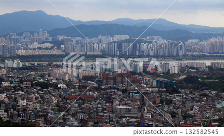 Seoul cityscape panorama showing Han River and mountains Seoul cityscape panorama showing Han River and mountains 132582545