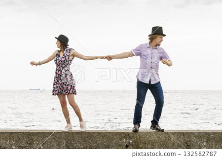 Retro couple looking opposite directions 132582787