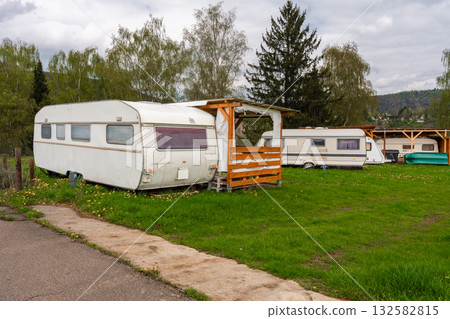 Vintage travel trailer in green campsite near Slapy lake in Czech Republic. 132582815