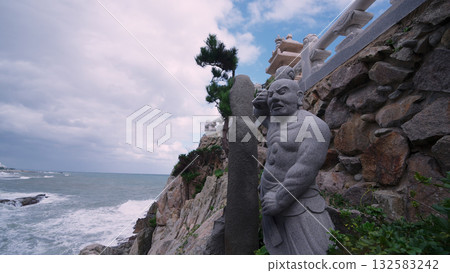 Buddhist stone sculpture at Haedong Yonggungsa Temple coastline Buddhist stone sculpture at Haedong Yonggungsa Temple coastline 132583242