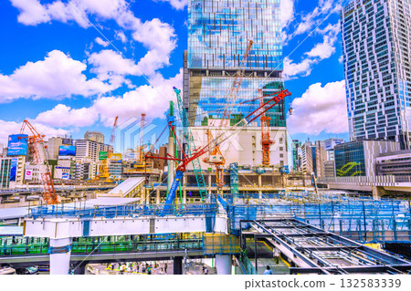 Tokyo cityscape in October. Huge heavy machinery such as crawler cranes are lined up... Steel beams are also on the left... = Shibuya, October 17th 132583339