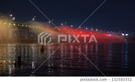 Banpo Bridge Rainbow Fountain illuminated at night on Han River Banpo Bridge Rainbow Fountain illuminated at night on Han River 132583352
