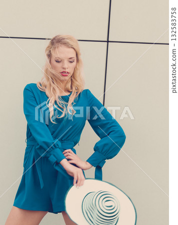 Fashion model wearing blue jumpsuit Fashion model wearing blue jumpsuit 132583758