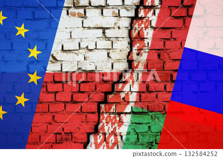 Concept of problem on Poland-Belarus border. Poland and EU flag on the one side and Belarus and Russian flag on the other side of crack on brick wall Concept of problem on Poland-Belarus border. Poland and EU flag on the one side and Belarus and Russian flag on the other side of crack on brick wall 132584252