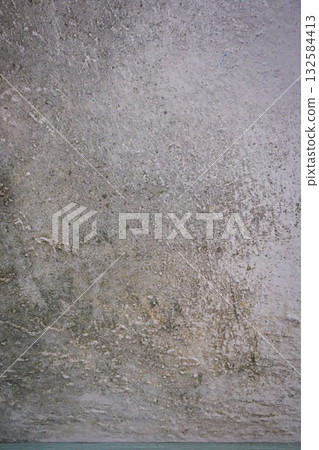 Mold and mildew spreading across a damp interior wall. Concept of moisture damage, humidity, and unhealthy home conditions. Suitable for home repair, renovation, and construction themes. Mold and mildew spreading across a damp interior wall. Concept of moisture damage, humidity, and unhealthy home conditions. Suitable for home repair, renovation, and construction themes. 132584413