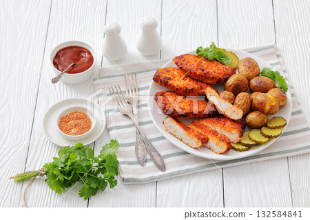 Paprika-Rubbed Pork Chops on plate with potatoes Paprika-Rubbed Pork Chops on plate with potatoes 132584841