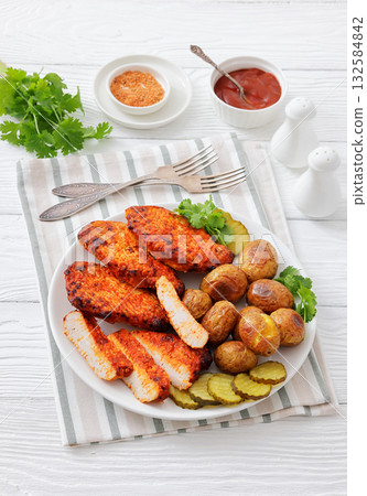 Paprika-Rubbed Pork Chops on plate with potatoes Paprika-Rubbed Pork Chops on plate with potatoes 132584842
