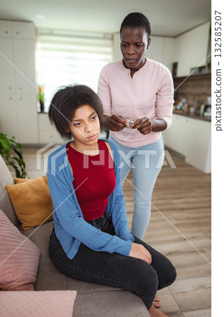 Mother scolding her teenage daughter at home Mother scolding her teenage daughter at home 132585207