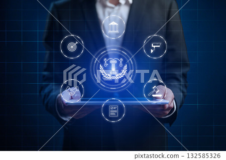 Business professional analyzing digital law and compliance solutions using a tablet 132585326