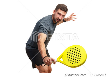 Skillful player prepares to serve in competitive pickleball match indoors Skillful player prepares to serve in competitive pickleball match indoors 132585414