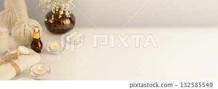 Wellbeing, cosmetology banner with spa accessories, serum, candles and towel on a white table. Wellness and skin care treatment. Concept of me time and self-care. Spa relax, massage procedure 132585549