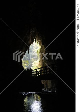 Light streaming into the cave entrance exploration path 132586264