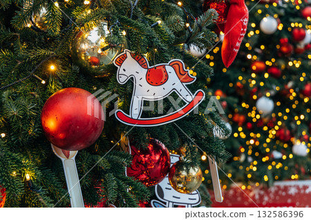 New Year's colorful trees in front of the Central Department Store in Moscow on Kuznetsky Most 132586396