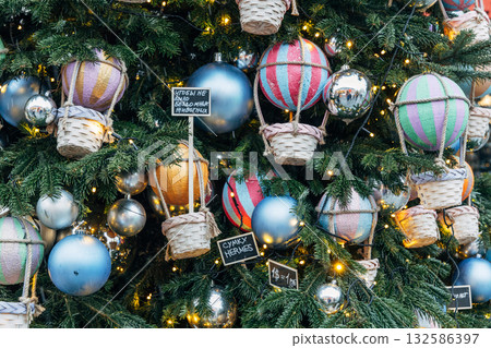 New Year's colorful trees in front of the Central Department Store in Moscow on Kuznetsky Most New Year's colorful trees in front of the Central Department Store in Moscow on Kuznetsky Most 132586397