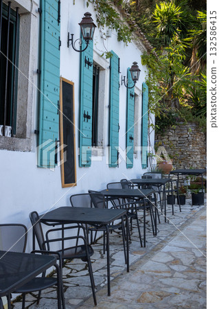 Restaurant with tables on the street, Corfu (Korfu), Greece Restaurant with tables on the street, Corfu (Korfu), Greece 132586415