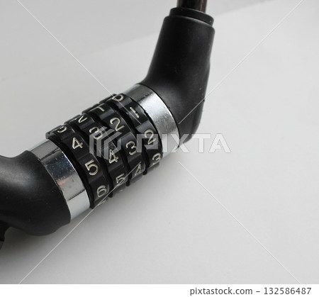 Details of Cable Lock for Bikes or Motorcycles. Bike Locks and Security Stock Photo Details of Cable Lock for Bikes or Motorcycles. Bike Locks and Security Stock Photo 132586487