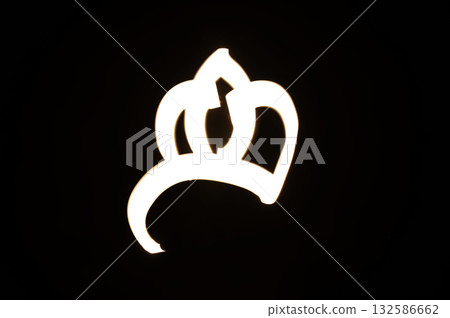 Light painting for Epiphany Day or Dia de Reyes Magos concept. Gold crowns, Star on black background 132586662