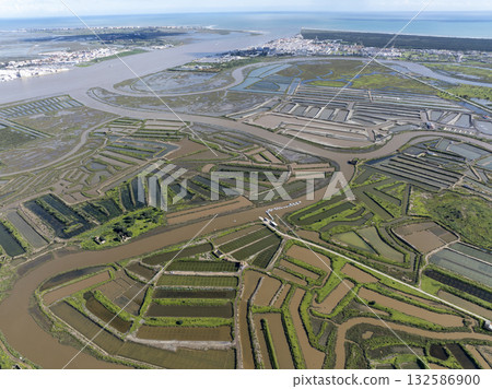 Flooded farming fields in Portugal, Aerial Landscare of Irrigated Agriculture in Europe. Abstract Pattern at Sunny Day Flooded farming fields in Portugal, Aerial Landscare of Irrigated Agriculture in Europe. Abstract Pattern at Sunny Day 132586900
