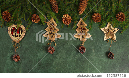 Beautiful Christmas and New Year banner, background with live fir branches, decorations, toys and pine cones, product design for holiday advertising, Christmas Eve concept, festive winter card Beautiful Christmas and New Year banner, background with live fir branches, decorations, toys and pine cones, product design for holiday advertising, Christmas Eve concept, festive winter card 132587316