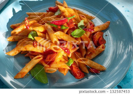 Italian classic pasta penne all'arrabbiata with tomatoes and chili 132587453