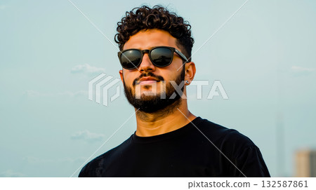A man with a beard and sunglasses on 132587861