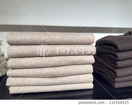 Luxury cashmere sweater neatly folded on shelf Luxury cashmere sweater neatly folded on shelf 132588525