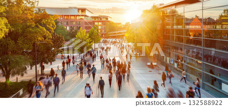 Crowd of students walking on modern university campus at sunset Crowd of students walking on modern university campus at sunset 132588922