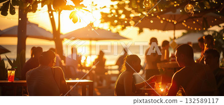 People relaxing at outdoor beach cafe during sunset with warm lighting People relaxing at outdoor beach cafe during sunset with warm lighting 132589117