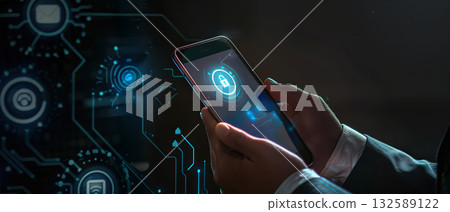Businessman holding smartphone with digital security lock hologram 132589122