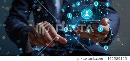 Businessman using smartphone with digital network hologram Businessman using smartphone with digital network hologram 132589123
