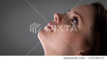 Young woman looking up with hope and faith, thinking and dreaming Young woman looking up with hope and faith, thinking and dreaming 132589317