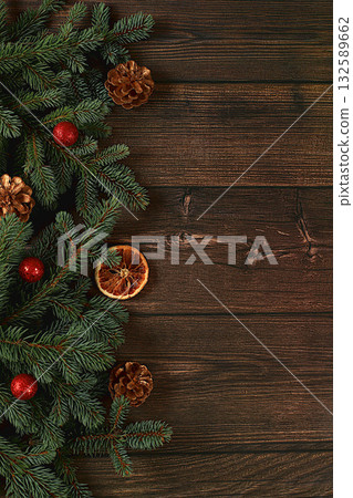 Christmas and New Year 2024 composition, background with blue fir branches with holiday decorations on a dark wooden table, banner for holiday screen, template for design. Holiday card 132589662