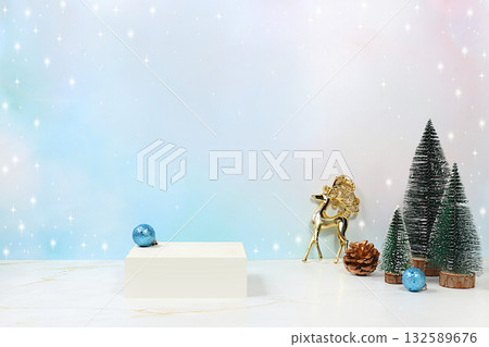 Empty modern table with fir trees and golden deer on a background of lights and bokeh. Christmas and New Year mockup for design and product display, minimal Merry Christmas concept, selective focus Empty modern table with fir trees and golden deer on a background of lights and bokeh. Christmas and New Year mockup for design and product display, minimal Merry Christmas concept, selective focus 132589676