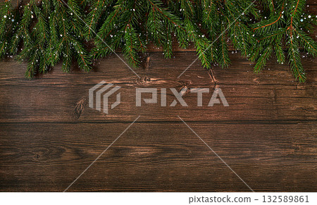 Christmas and New Year 2024 background with fir branches covered with snowflakes on a wooden table, toys and decorations, banner for holiday screen, template for design. Holiday card, selective focus, Christmas and New Year 2024 background with fir branches covered with snowflakes on a wooden table, toys and decorations, banner for holiday screen, template for design. Holiday card, selective focus, 132589861