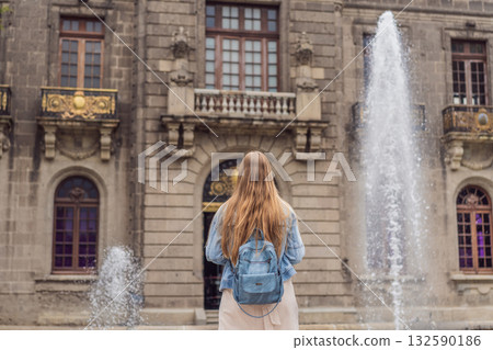 Young woman tourist standing near Chapultepec Castle in Mexico City, exploring the historic landmark. Solo travel, cultural heritage, tourism, and adventure concept Young woman tourist standing near Chapultepec Castle in Mexico City, exploring the historic landmark. Solo travel, cultural heritage, tourism, and adventure concept 132590186