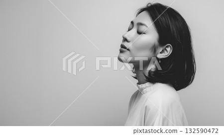 Monochrome female portrait that combines serenity and beauty 132590472