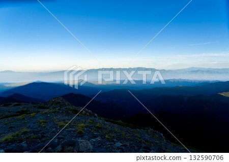 The shadow of Mt. Ainotake and the Central Alps (view from the summit of Mt. Ainotake) Climbing Mt. Ainotake and Mt. Notoritake of the Shiramine Sanzan in the Southern Alps 132590706